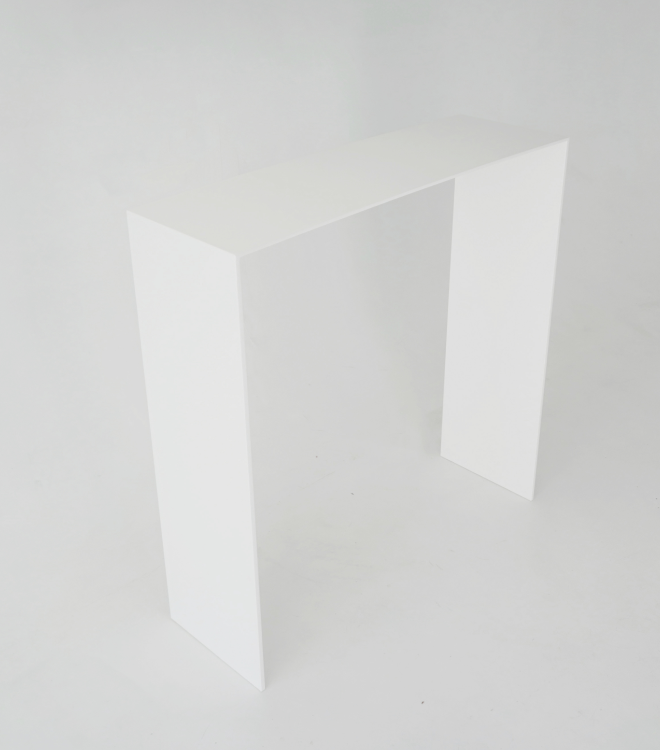 A left angle perspective of the minimalist white console with a thin rectangular top and two slightly thicker straight legs.